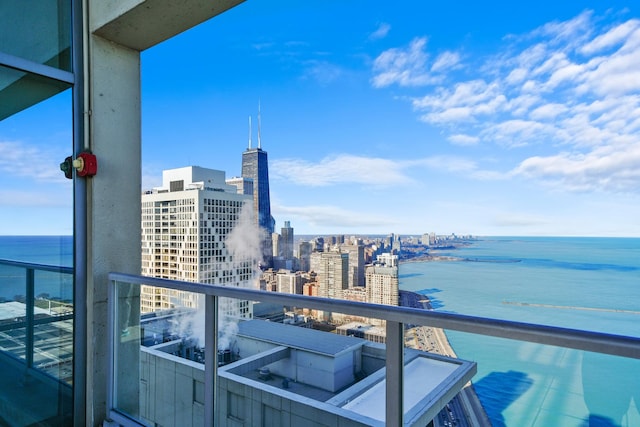 balcony featuring a water view and a view of city