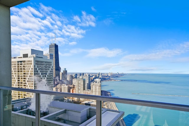 balcony featuring a view of city and a water view