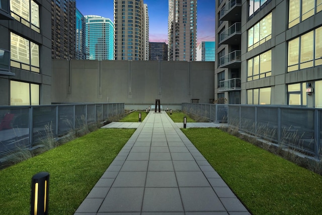 surrounding community featuring fence and a city view