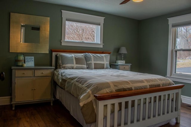 5-124 Sunrise Ct, Lanark, IL 61046 - bedroom featuring ceiling fan, baseboards, and dark wood-type flooring