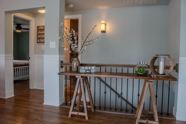5-124 Sunrise Ct, Lanark, IL 61046 - stairs with visible vents, wood finished floors, and wainscoting