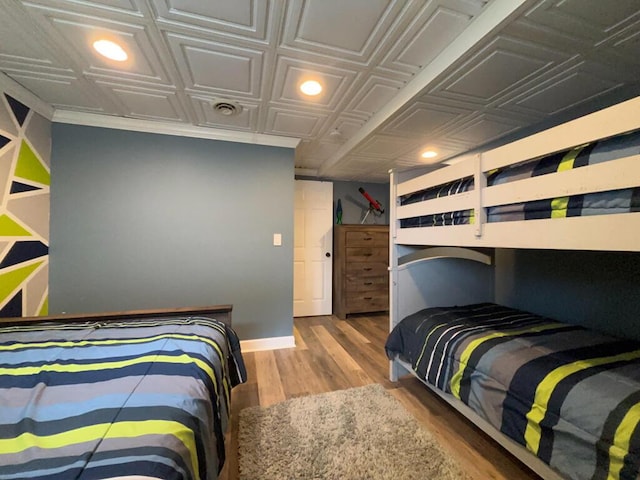 5-124 Sunrise Ct, Lanark, IL 61046 - bedroom featuring an ornate ceiling, baseboards, and wood finished floors