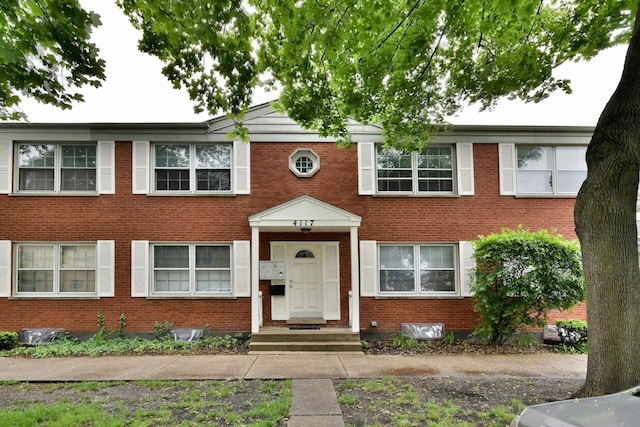 view of front of house featuring brick siding