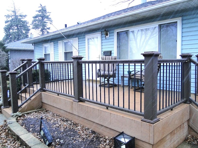 back of house with a wooden deck