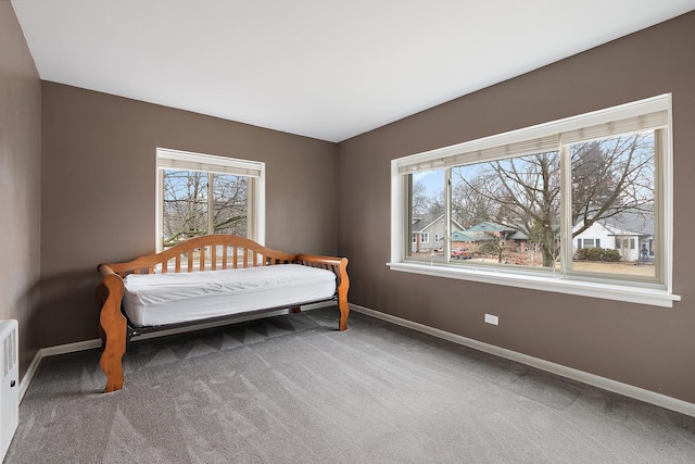 bedroom with carpet and baseboards