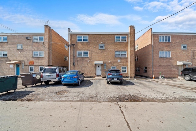 view of property with uncovered parking