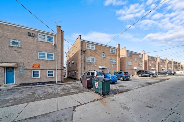 view of property featuring uncovered parking