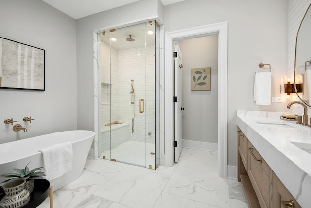 bathroom with double vanity, a stall shower, baseboards, marble finish floor, and a sink