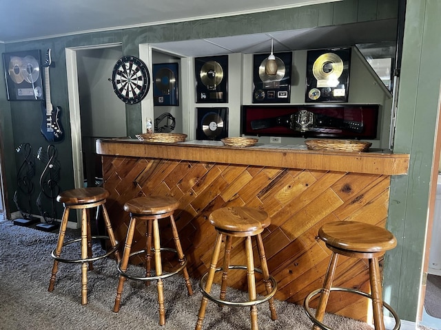 bar with a bar and crown molding