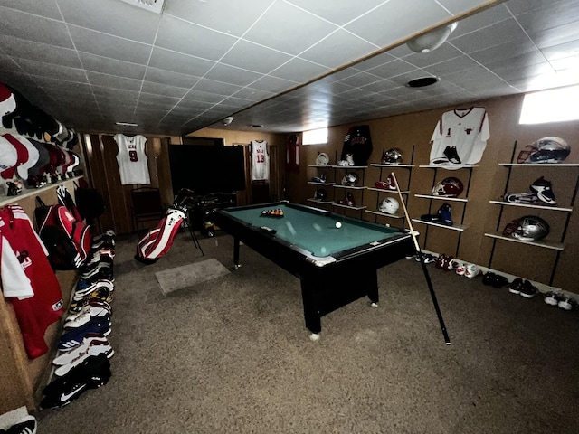 playroom with a paneled ceiling and carpet flooring