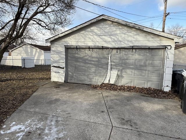 detached garage with fence