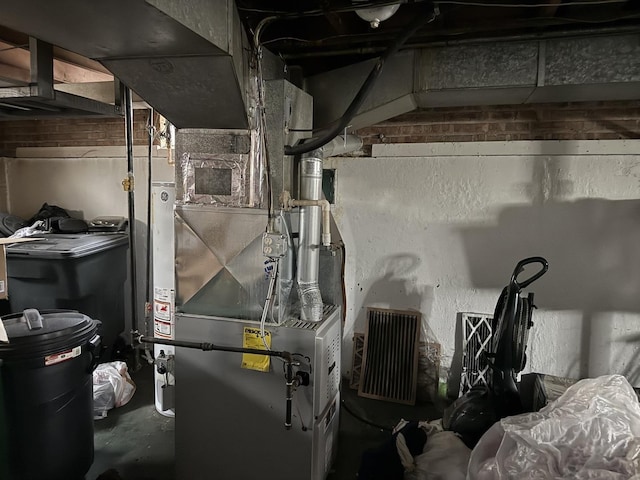 utility room featuring heating unit