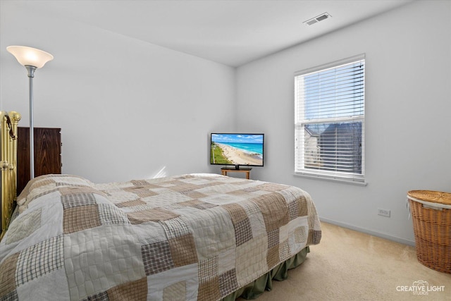 bedroom featuring carpet floors, visible vents, and baseboards