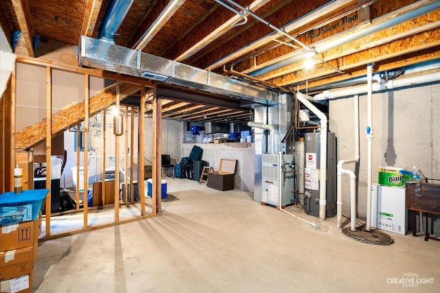 unfinished basement with gas water heater and heating unit