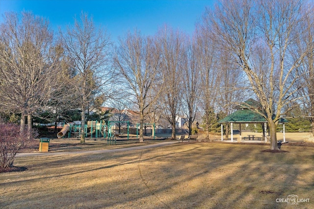 view of yard featuring playground community and a gazebo