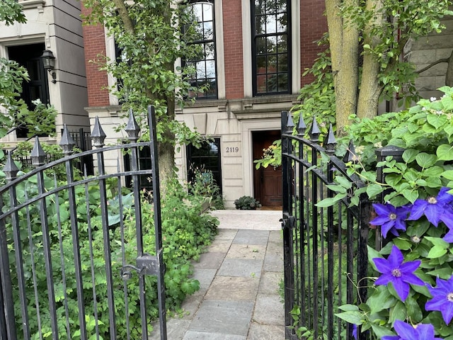 doorway to property with brick siding