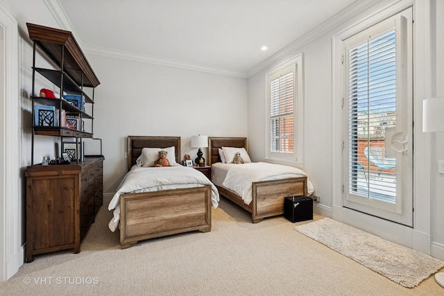 carpeted bedroom with access to exterior, crown molding, and baseboards