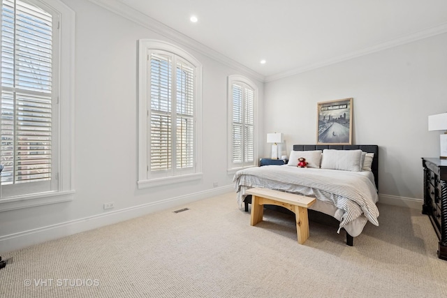 carpeted bedroom featuring crown molding, recessed lighting, baseboards, and visible vents