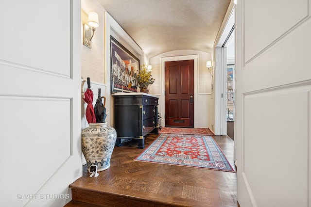 foyer entrance featuring vaulted ceiling