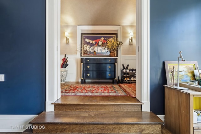 interior space featuring a wainscoted wall