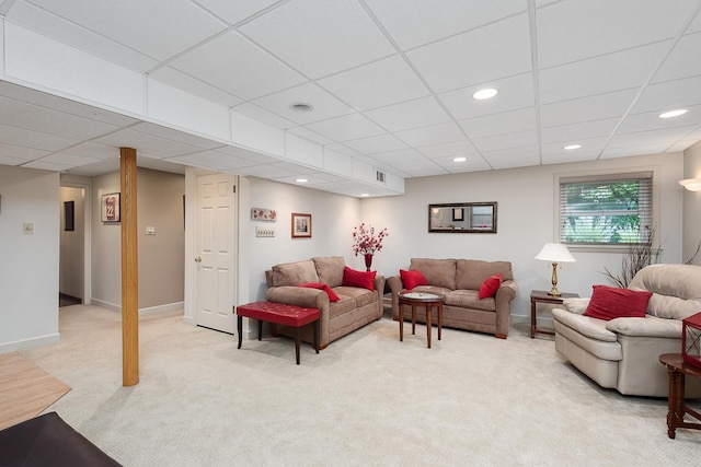 living room with recessed lighting, light carpet, visible vents, and baseboards