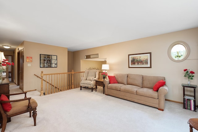 carpeted living room featuring baseboards