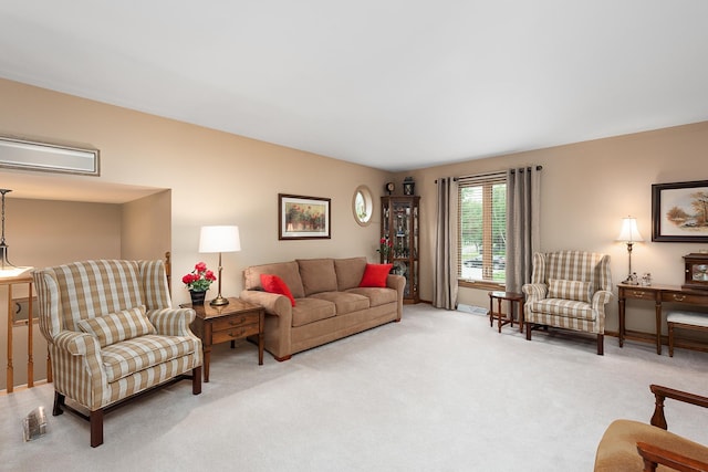 living room with baseboards and light colored carpet