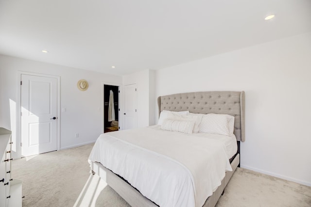 bedroom featuring recessed lighting, baseboards, and light colored carpet