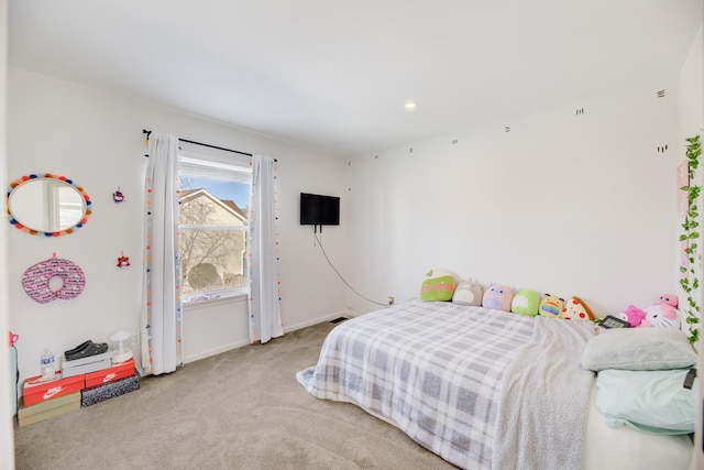 bedroom featuring carpet and baseboards