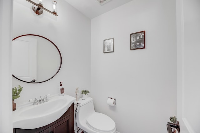 half bath with vanity and toilet