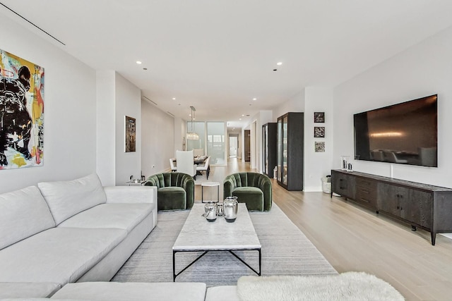 living room with recessed lighting and light wood-type flooring