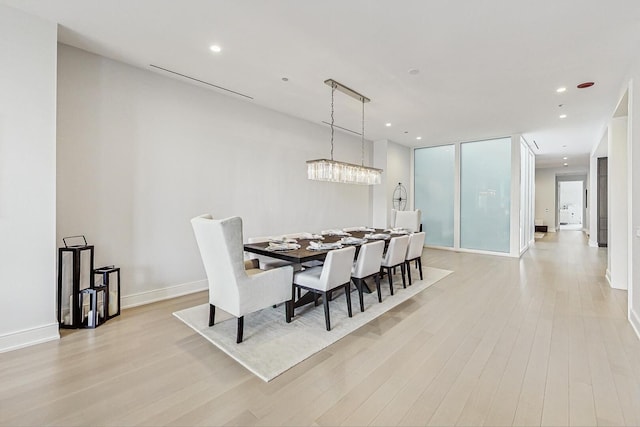 dining space with recessed lighting, baseboards, and light wood-style flooring