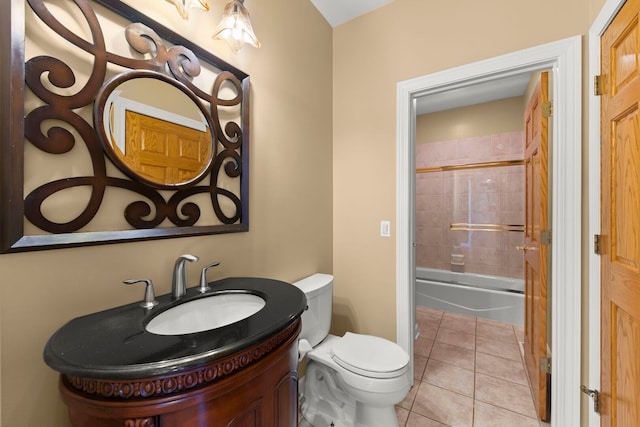 full bathroom featuring tile patterned flooring, bathtub / shower combination, vanity, and toilet