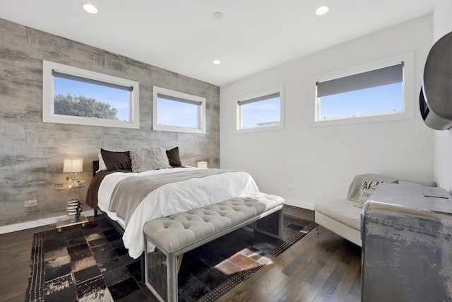 bedroom with baseboards, dark wood finished floors, and recessed lighting