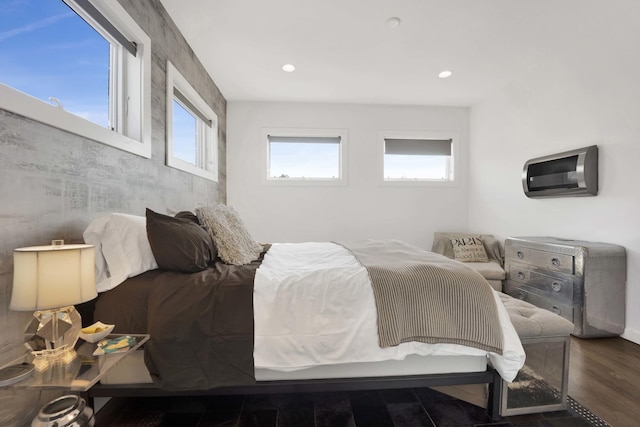 bedroom with wood finished floors and recessed lighting