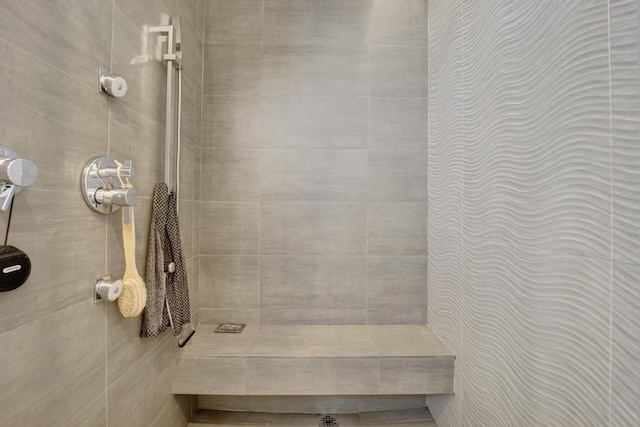 bathroom with a tile shower