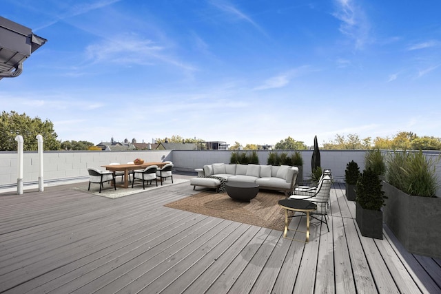 wooden terrace featuring an outdoor living space