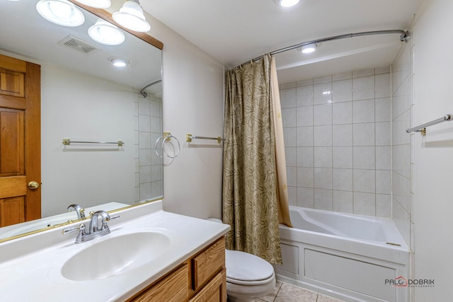 bathroom featuring shower / tub combo with curtain, visible vents, toilet, vanity, and tile patterned floors