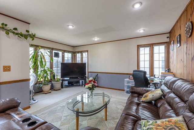 living area with crown molding, recessed lighting, baseboards, and light colored carpet