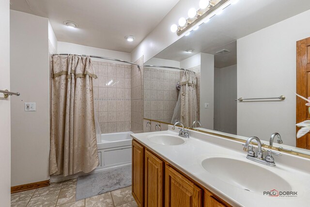 full bathroom with shower / tub combo with curtain, visible vents, a sink, and double vanity