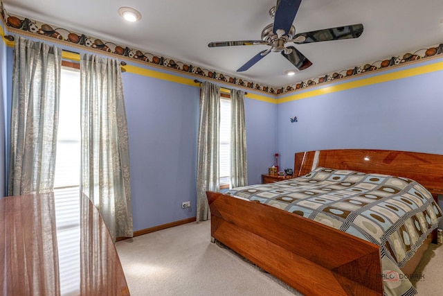 carpeted bedroom with baseboards