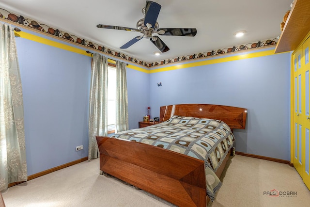 bedroom featuring ceiling fan, carpet flooring, and baseboards