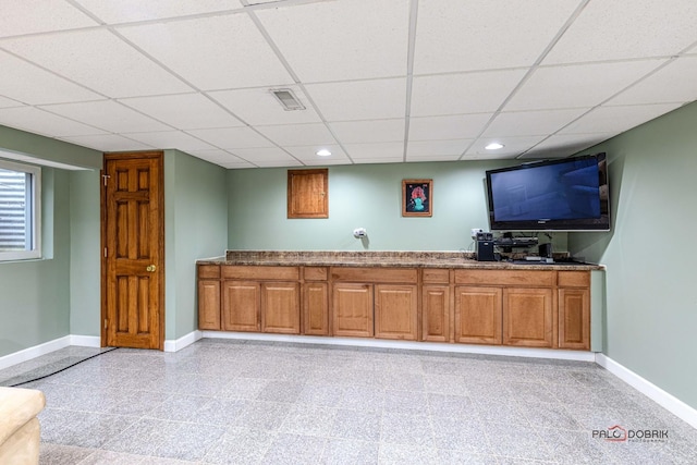 bar with recessed lighting, a drop ceiling, and baseboards