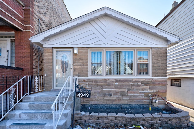 property entrance with brick siding