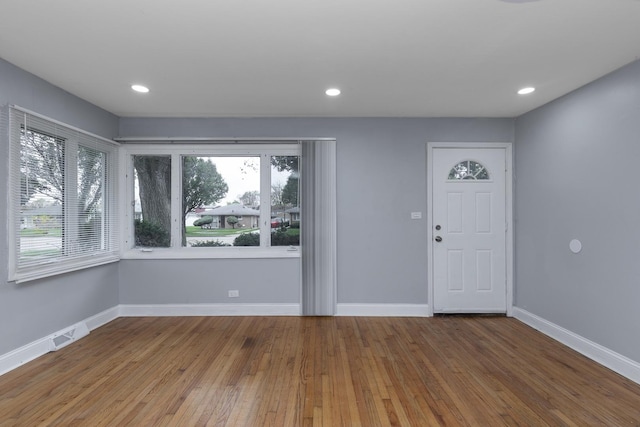 foyer entrance with visible vents, recessed lighting, hardwood / wood-style flooring, and baseboards