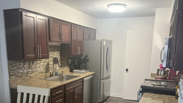 1057 Southgate Rd, New Lenox, IL 60451 - kitchen featuring dark wood-style floors, a sink, decorative backsplash, dark brown cabinetry, and appliances with stainless steel finishes