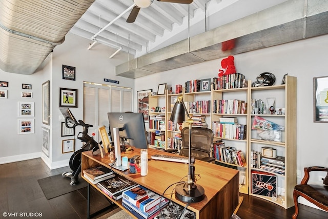 home office with wood finished floors, a ceiling fan, and baseboards