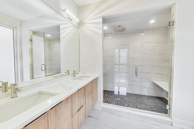 bathroom with a sink and a marble finish shower