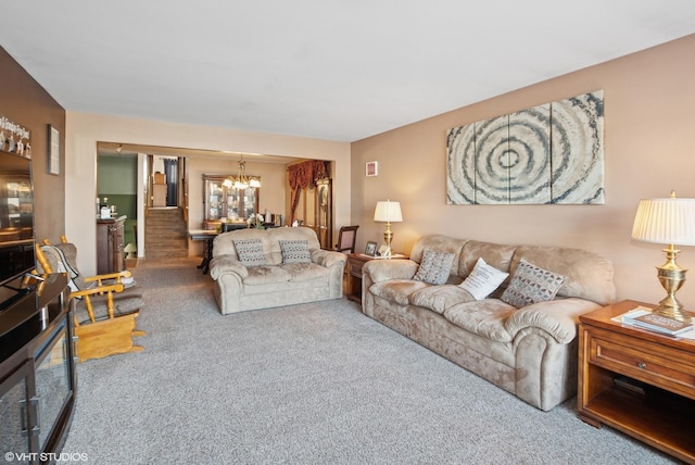 carpeted living room with an inviting chandelier