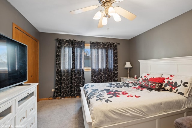 bedroom featuring ceiling fan, carpet flooring, and baseboards